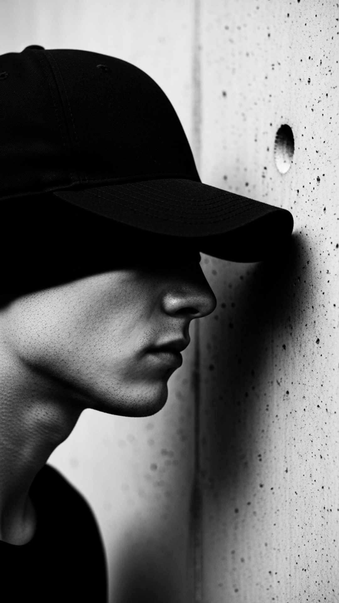 Mysterious hidden face DP of a boy with a cap obscuring his eyes in shadow