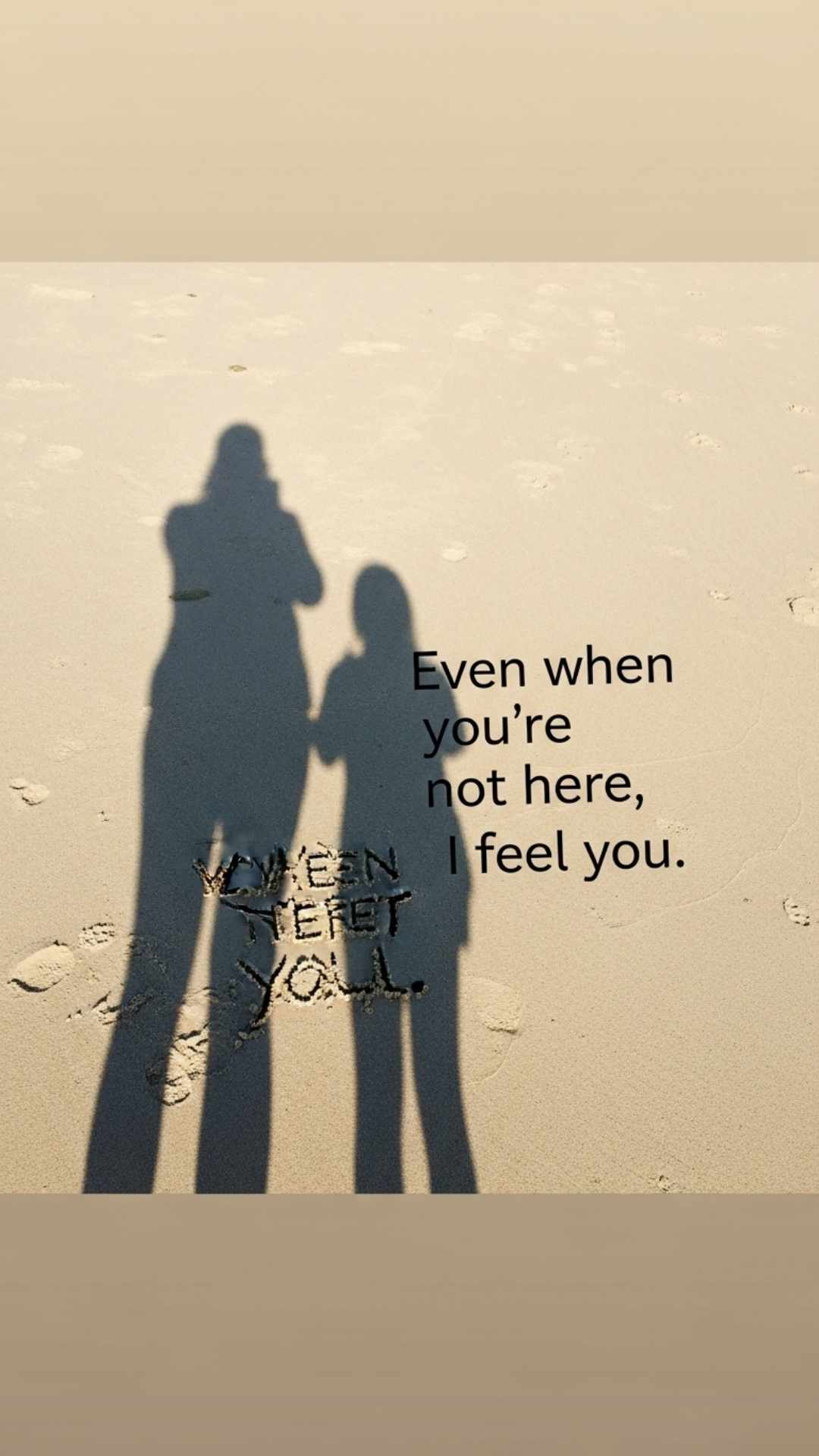 A photo of a person's shadow next to an imagined shadow on a sandy beach with a love quote.