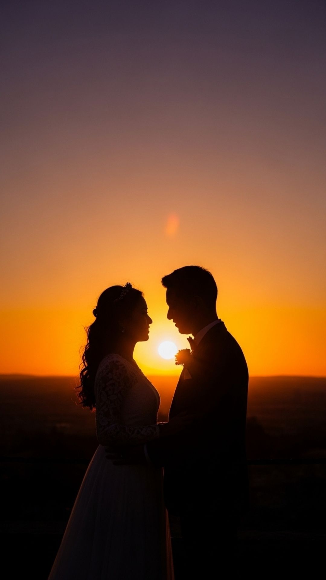 A cinematic, ultra-sharp silhouette of a couple against a colorful sunset, emphasizing professional image quality.