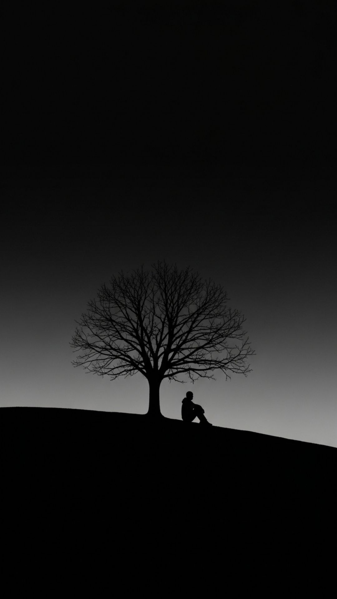 A high-contrast black and white DP featuring a silhouette of a person sitting alone under a barren tree against an empty sky