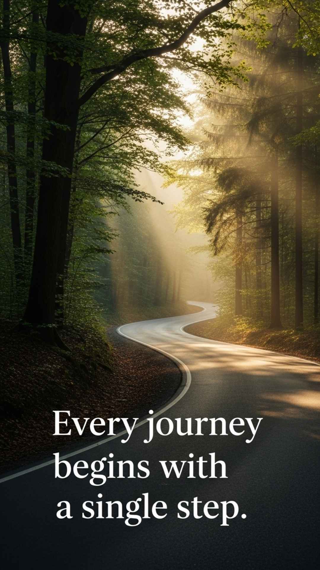 A winding road disappears into a misty forest at sunrise. The photo symbolizes a new beginning, with a motivational quote placed elegantly in the foreground.