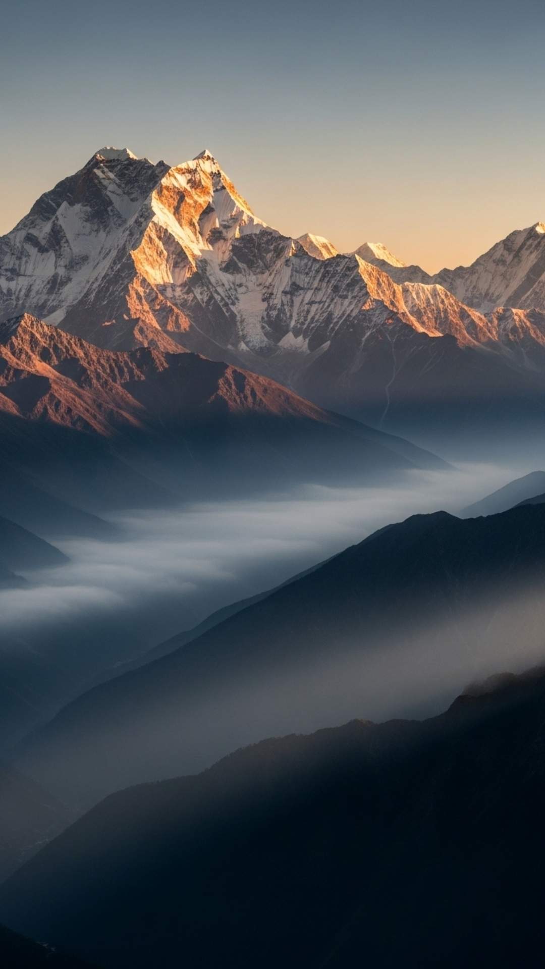A stunning landscape of a majestic mountain range at sunrise with mist in the valleys, serving as a hero image for a guide on Nature DP for WhatsApp.
