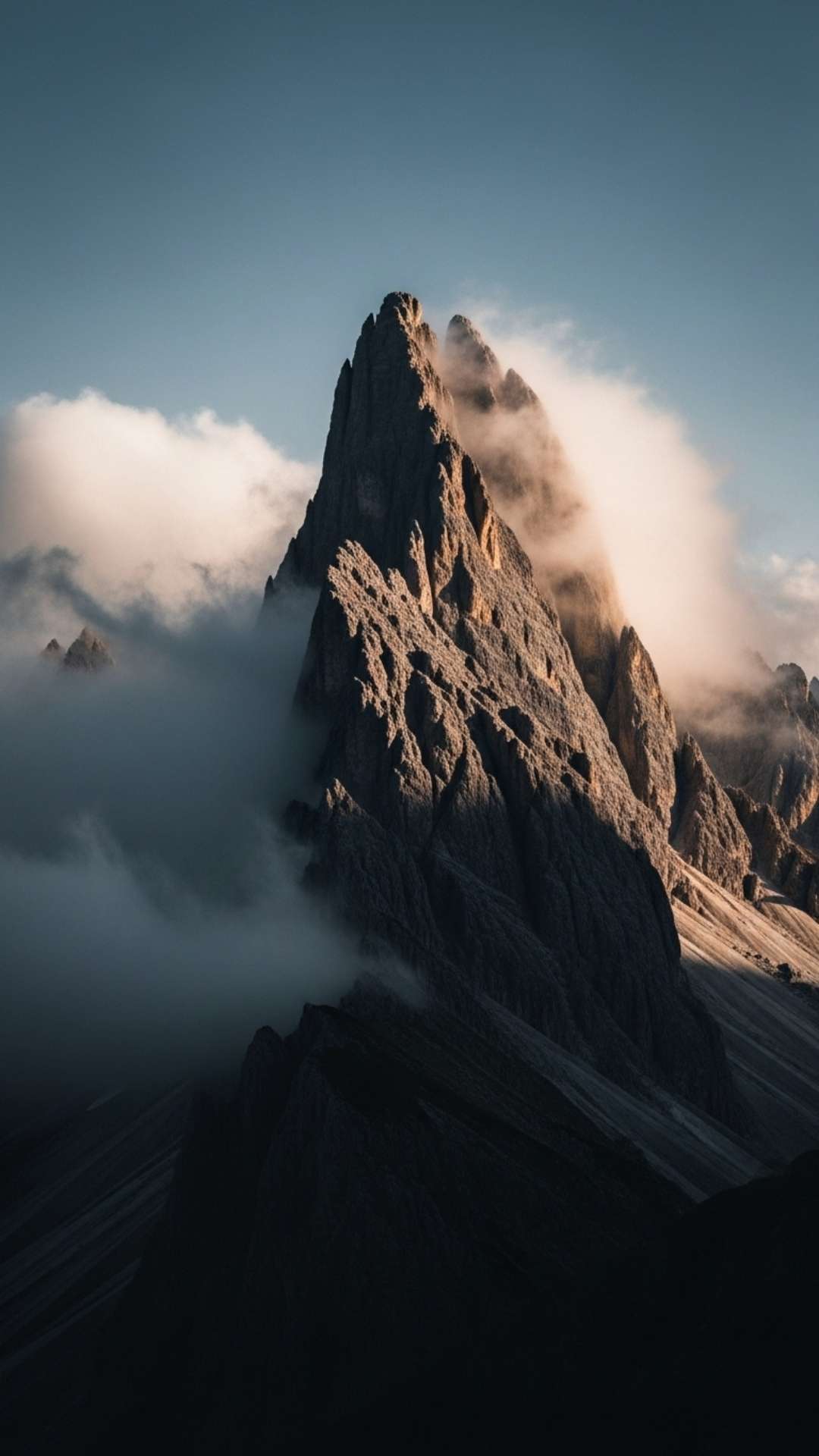WhatsApp DP image of a sharp, jagged mountain peak shot from a low angle, conveying a sense of power and determination for nature lovers.