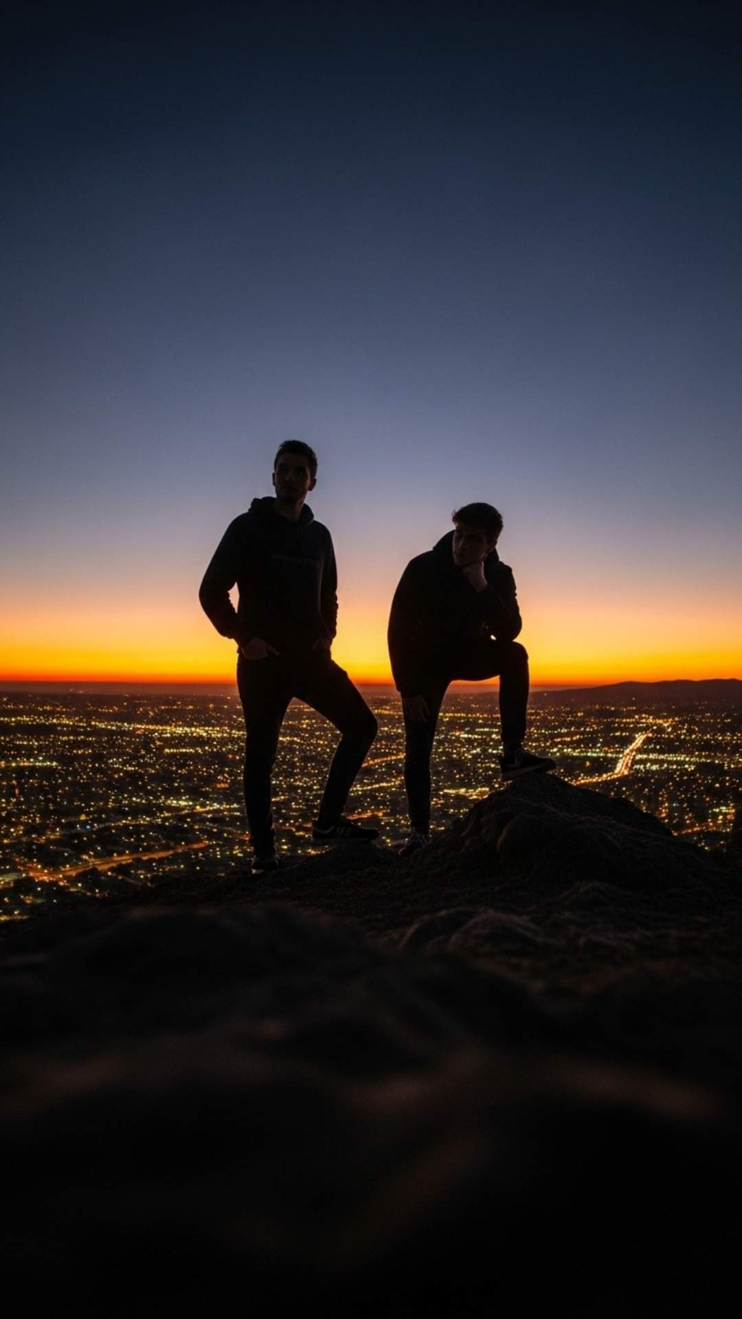 An epic Friendship DP for Boys with two bros as silhouettes overlooking a city, representing a shared adventure, confident stances, and brotherhood