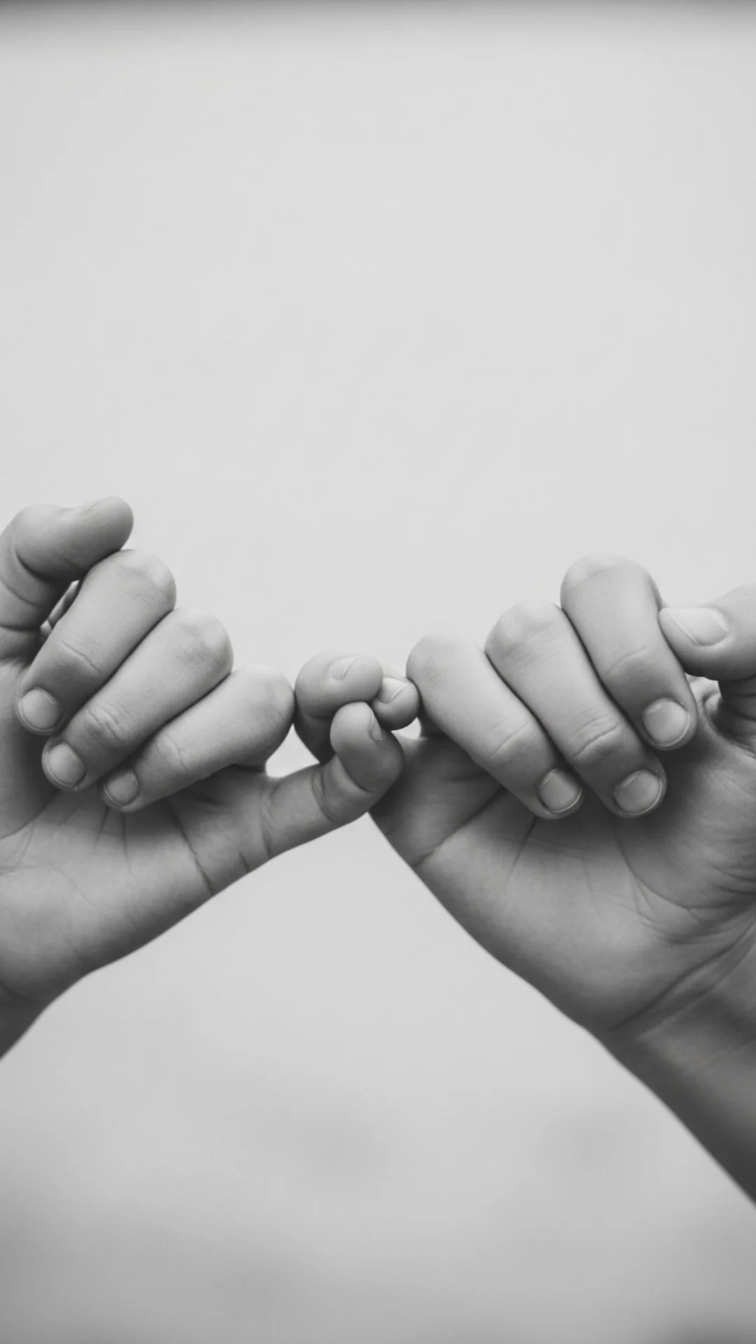 A symbolic and artistic black and white DP of a brother and sister's pinky promise, representing an unbreakable bond. This minimalist, high-resolution image is a unique and emotional choice for a WhatsApp DP, demonstrating deep trust, profound sibling love, and providing a helpful, high-quality visual for users seeking 'heartfelt sibling images'.