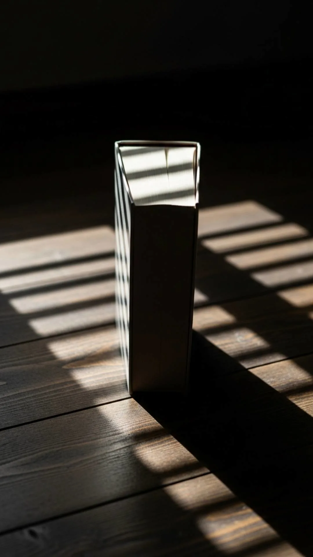 A "Play with Light" guide image demonstrating the 'Harsh Light' technique. Direct sunlight creates strong, defined shadows across a book, resulting in a 'deep and moody' artistic effect for a unique and stylish book DP, a long-tail keyword idea for creative Indian users.