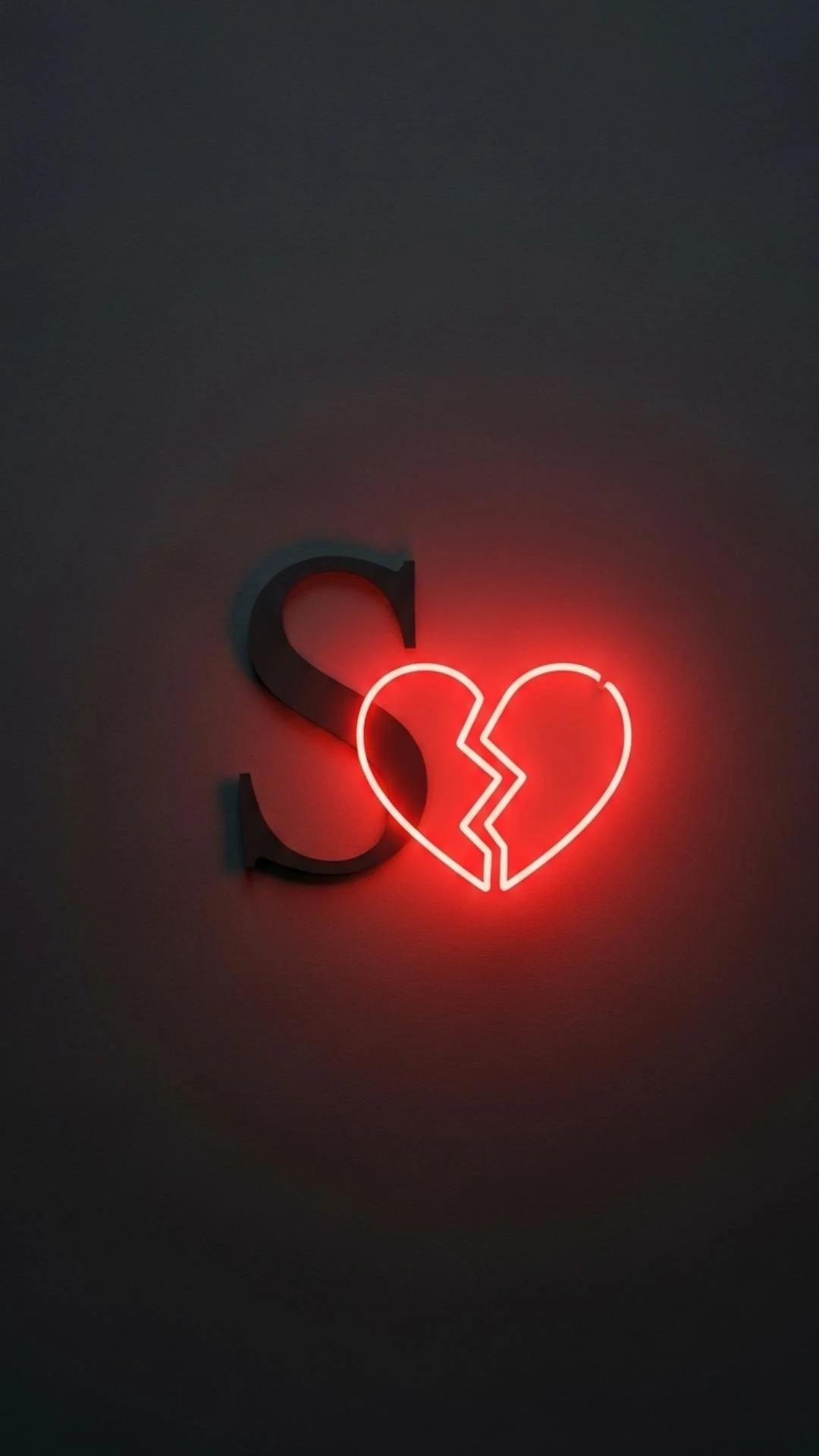 A sad S letter DP with a broken heart, featuring a dark 'S' beside a glowing neon red broken heart icon. This symbolic, sad S name DP is a clear expression of heartbreak for a WhatsApp or Instagram profile in India. Free HD 4K download from Majekfilms.com