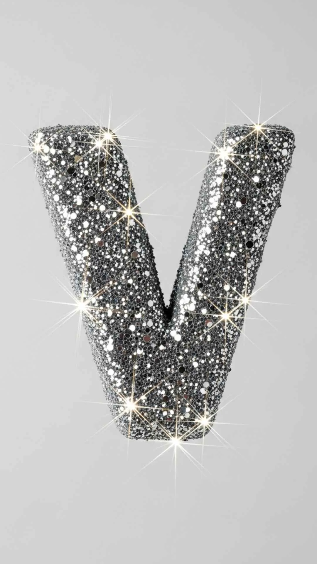 A glamorous 4K 'V' letter DP, showing a close-up of the letter 'V' covered in sparkling 'silver glitter' with beautiful bokeh. This 'cute V name dp' is an eye-catching and stylish choice for a girl's WhatsApp or Instagram profile in India. Keywords: V letter glitter dp, silver V name dp, V alphabet sparkle, cute V dp 4K, stylish V letter images for dp girl.