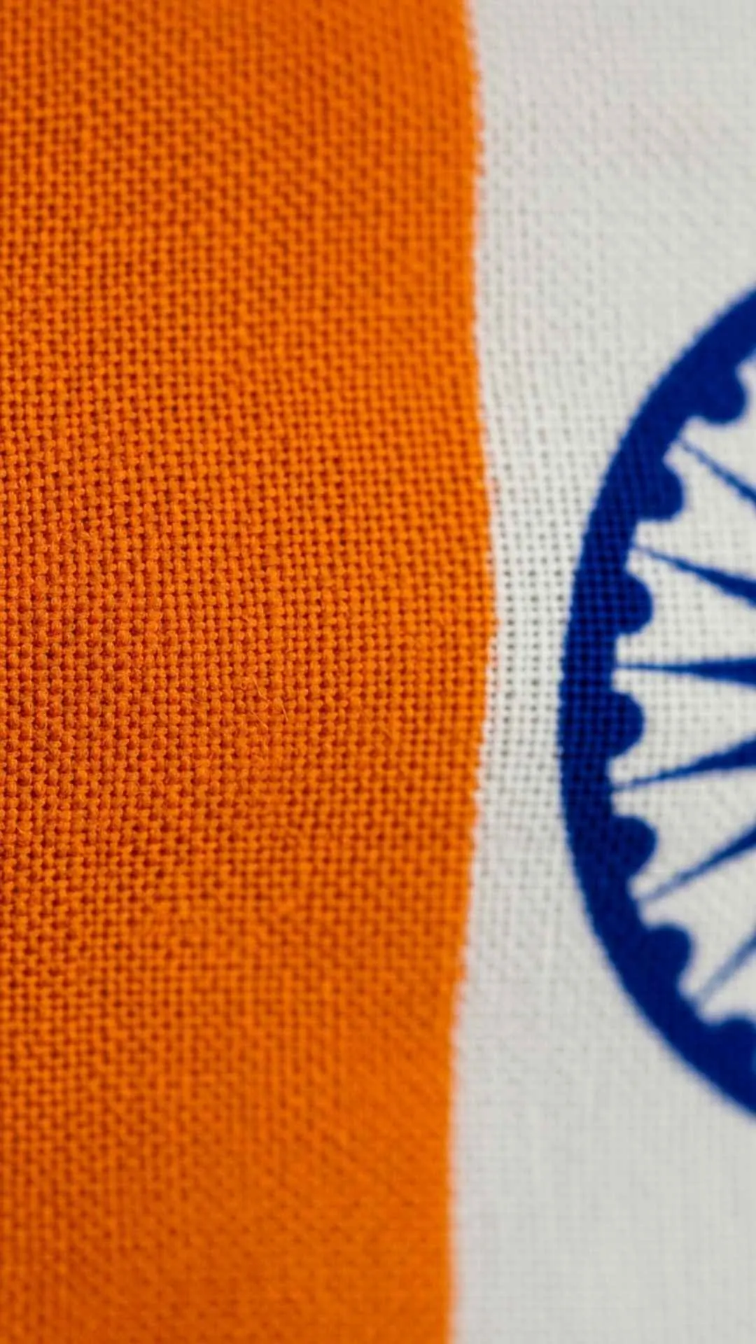 A 4K close-up image of the Indian flag's fabric texture, showing the high-quality detail of the saffron and white cloth. This classic and formal DP photo is sharp and not pixelated, ideal for a free HD 1080p wallpaper download.