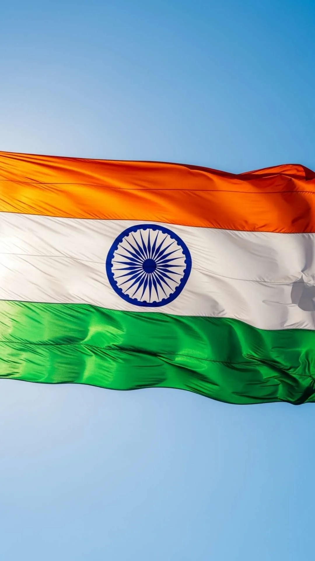 Classic Flag of India DP image in HD 1080p, showing the Tiranga waving majestically against a clear blue sky. This formal 9:16 wallpaper is perfect for a WhatsApp DP to show respect on Independence Day. High-quality and sharp