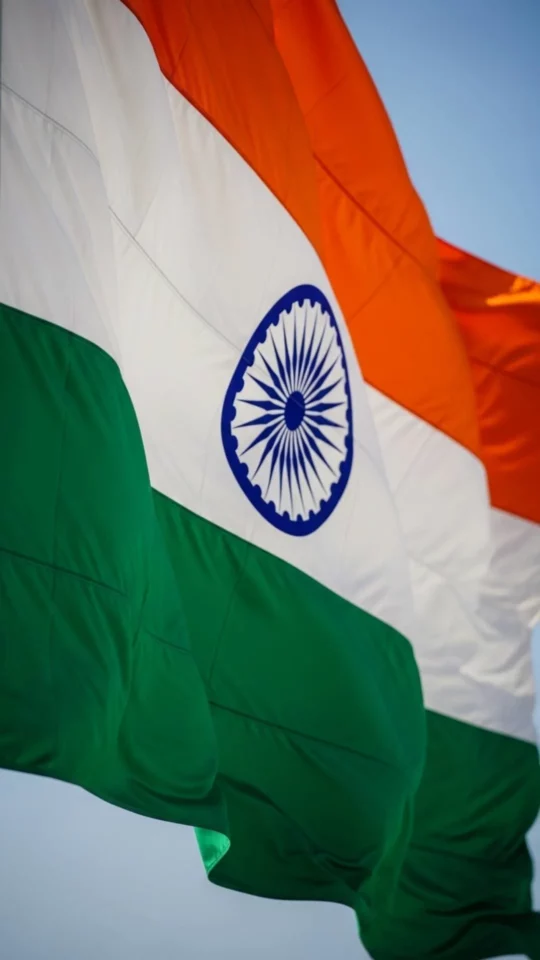 A high-definition (HD) 9:16 vertical image of the Flag of India (Tiranga) waving, perfect for a WhatsApp DP or wallpaper. The clear, sharp detail shows the texture of the saffron, white, and green flag, signifying respect and pride for national holidays like Independence Day