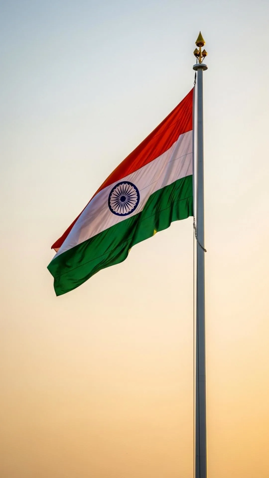 Formal 9:16 Flag of India DP image showing the Tiranga waving at sunrise. This majestic HD wallpaper captures the flag in golden hour light, symbolizing pride. A perfect, high-quality 1080p download for a classic profile picture.