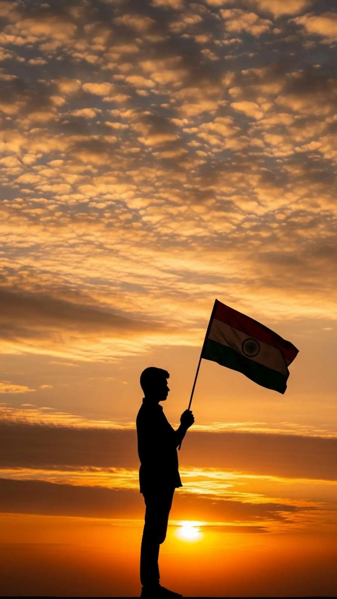 A powerful 'Indian flag DP boy' silhouette in 9:16 format, showing a boy holding the Tiranga against a patriotic sunrise. This artistic and respectful image is a popular HD wallpaper download for a personal WhatsApp DP on Independence Day
