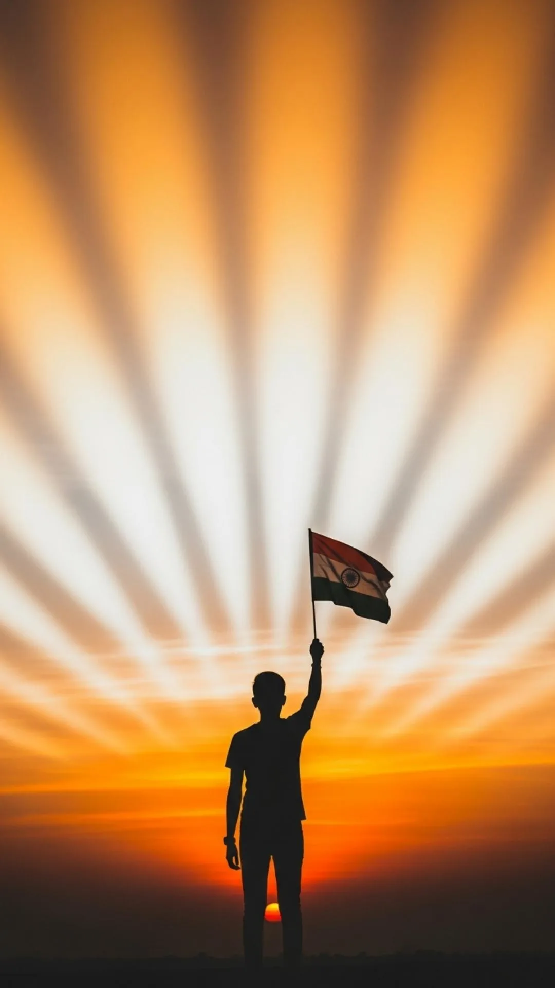 An artistic Flag of India DP image showing a silhouette of a 'boy' or 'girl' holding the Tiranga against a patriotic sunrise. This 9:16 wallpaper evokes personal pride and is a popular 'attitude DP' choice for Independence Day and Republic Day.
