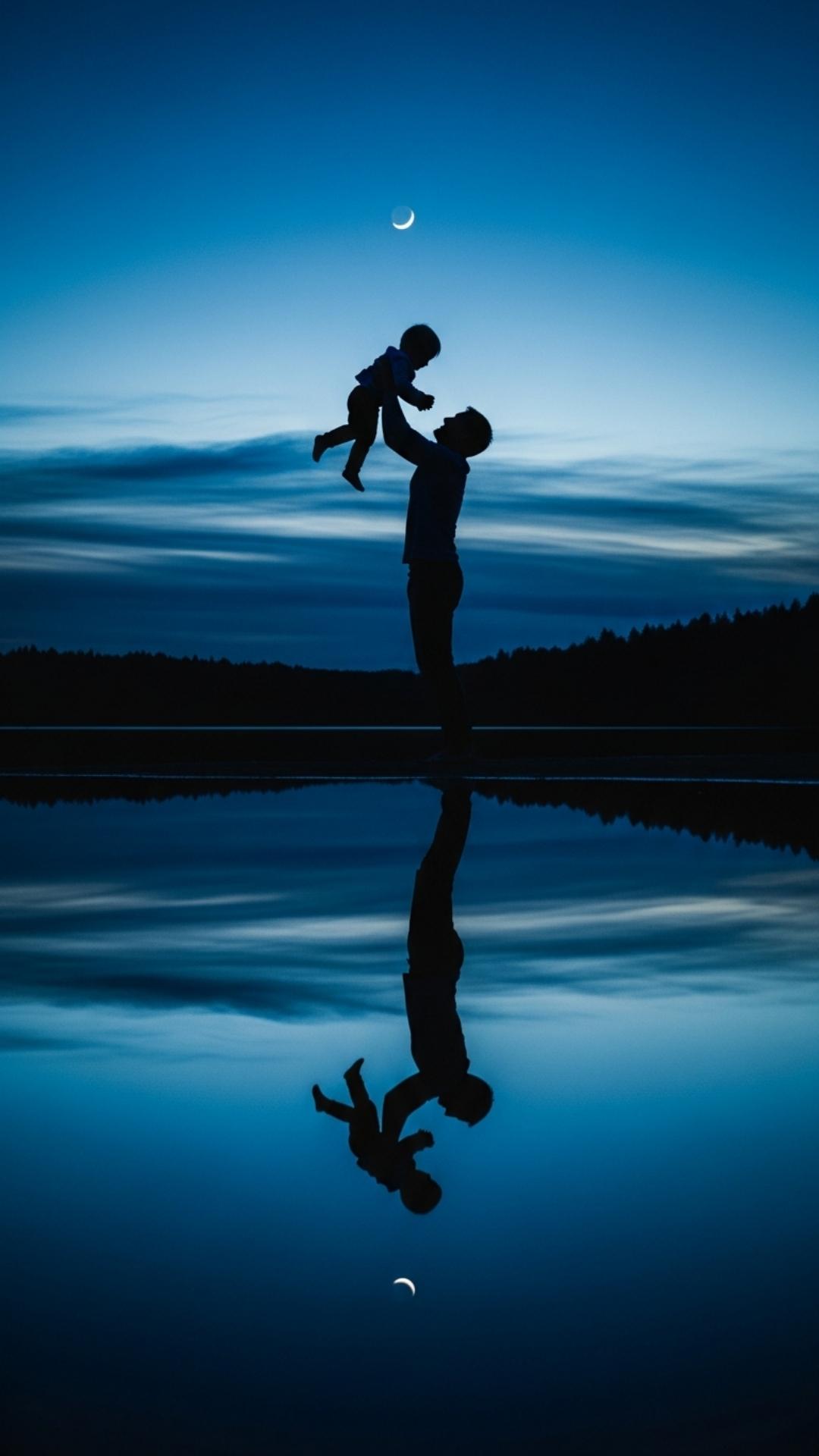 A moody vertical silhouette reflection of a father and child at twilight, utilizing deep blue tones for an artistic and emotional family profile picture suitable for introverts and art lovers.